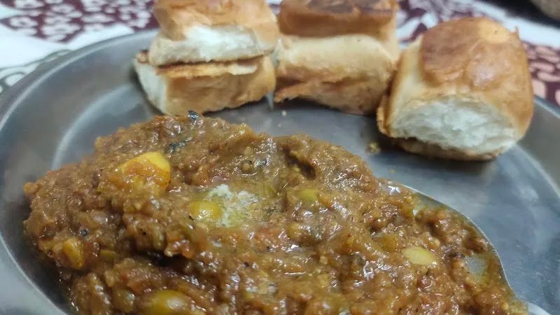 Pav bhaji served on a steel plate